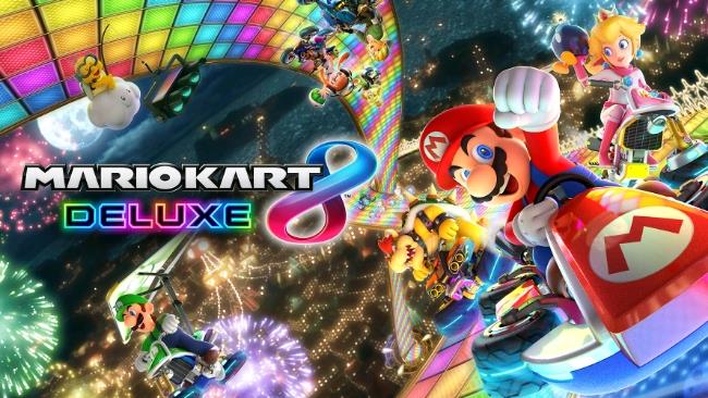 Super Mario e altri personaggi sui loro kart L'immagine promozionale del titolo videoludico