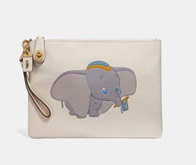 bustina da polso turnlock 30 disney x coach con chiusura girevole e dumbo