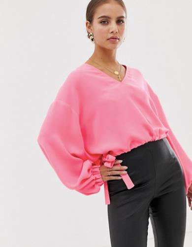Maglia fucsia con scollo a V