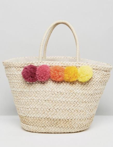 Borsa spiaggia con pon pon Borsa da spiaggia di colore chiaro con pon pon