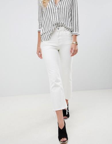 Jeans cropped a zampa