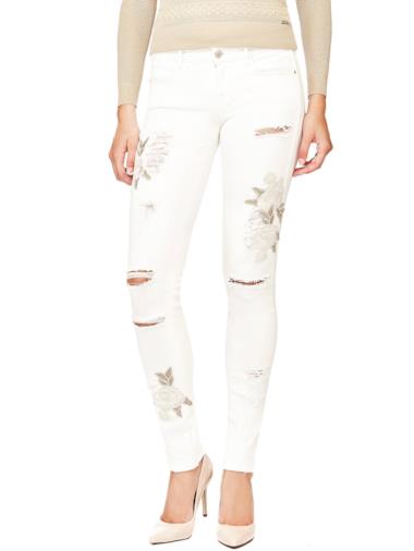 Jeggings applicazioni floreali e strappi