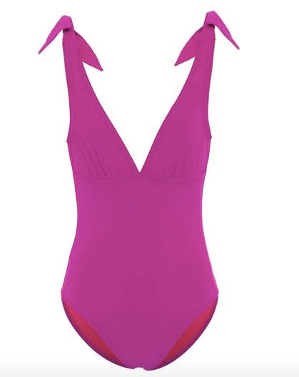 L'intero scollato distoglie dalla parte inferiore del corpo Femminili i fiocchetti da annodare sulle spalle