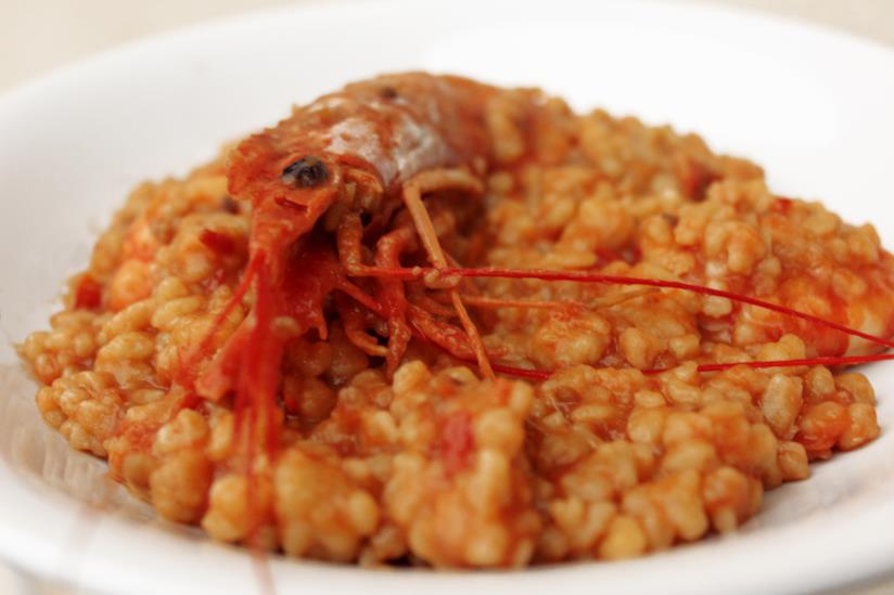 Fregola con gamberi e pomodori Fregola con gamberi e pomodori