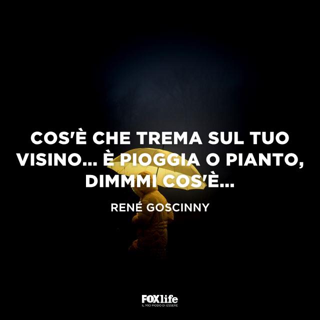 Frase lacrime Bambino sotto un ombrello giallo