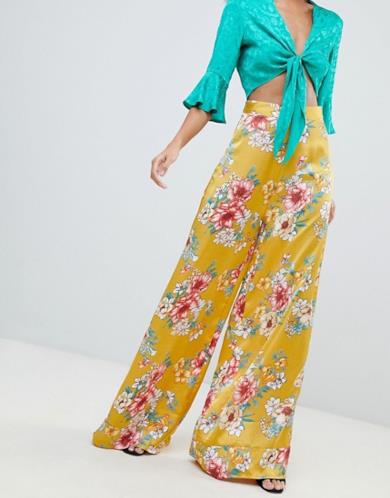 Pantaloni gialli palazzo a vita alta con stampa a fiori