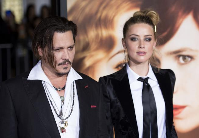 Johnny Depp ha rinunciato a un evento per evitare di incontrare l'ex moglie Amber Heard Johnny Depp e Amber Heard