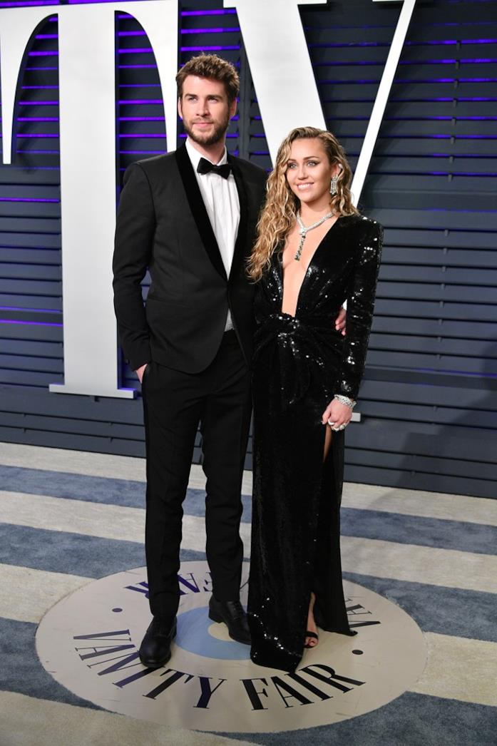Miley Cyrus e Liam Hemsworth Miley Cyrus e Liam Hemsworth, i look al party di Vanity Fair