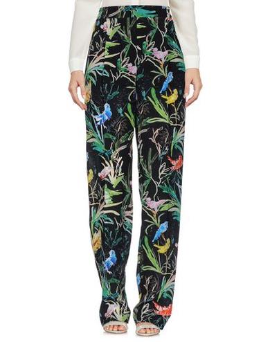 Pantaloni da donna modello a palazzo con fiori e uccellini