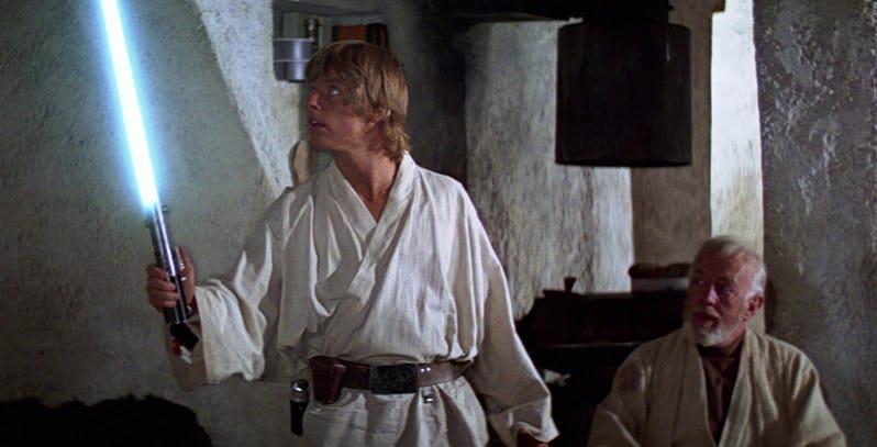 Ritirata dall'asta la spada originale di Star Wars Immagine di Luke Skywalker e Obi-Wan