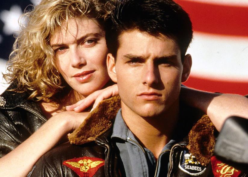 Top Gun: Maverick, Paramount sarebbe intenzionata ad assicurarsi un panel al Comic-Con di San Diego Tom Cruise e Kelly McGillis nel poster del primo Top Gun