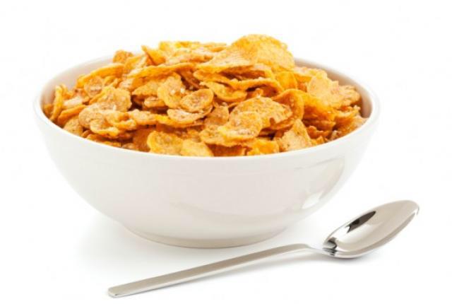 Corn Flakes Cereali di Corn Flakes contenuti in una ciotola bianca