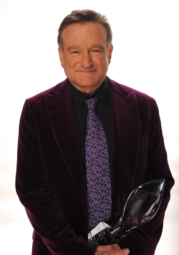 Robin Williams Robin Williams con un premio in mano