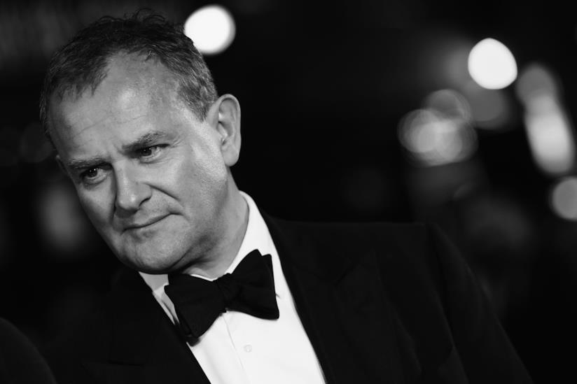 Il film di Downton Abbey potrebbe avere dei sequel, ne parla l'attore Hugh Bonneville L'attore Hugh Bonneville in una foto bianco e nero